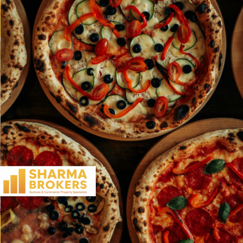 An overhead view of four different pizzas on wooden boards, with a "SHARMA BROKERS" logo