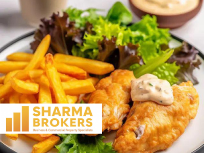 A plate of golden, battered fish fillets served with a side of crisp fries, fresh green lettuce salad, and a bowl of creamy dipping sauce, featuring the SHARMA BROKERS logo